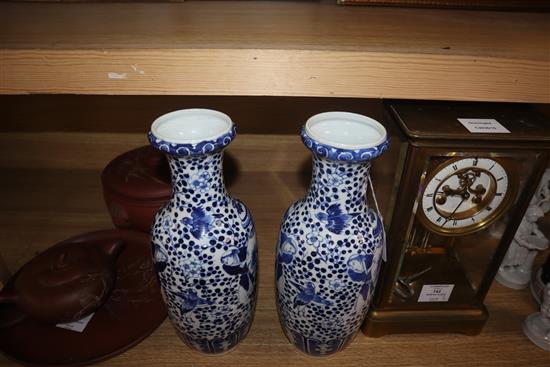 A pair of 19th century Chinese blue and white vases height 30cm